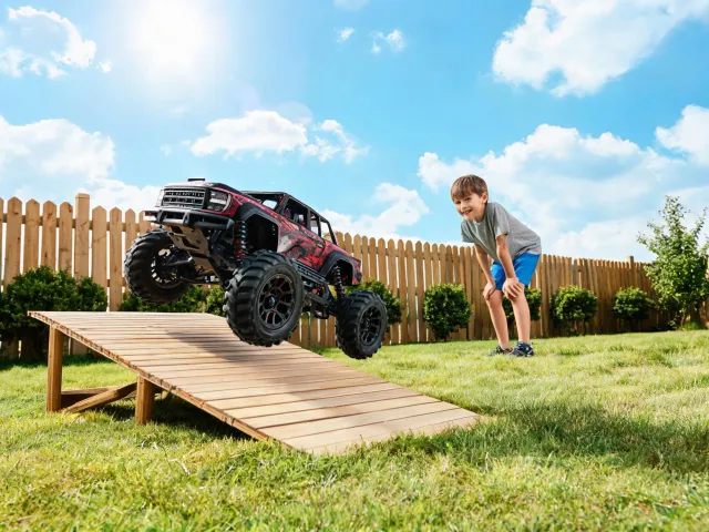 Backyard RC truck jumping small ramp